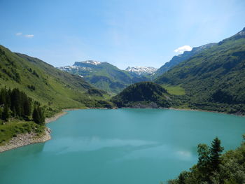 Scenic view of mountains and lake against sky