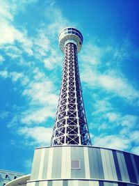 Low angle view of tower against cloudy sky
