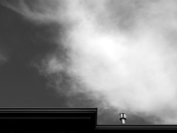 Low angle view of building against cloudy sky