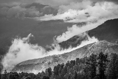 Scenic view of mountains against cloudy sky