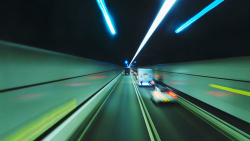 Blurred view of cars driving in tunnel