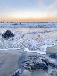 Scenic view of sea against sky during sunset