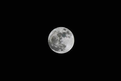 Low angle view of full moon at night