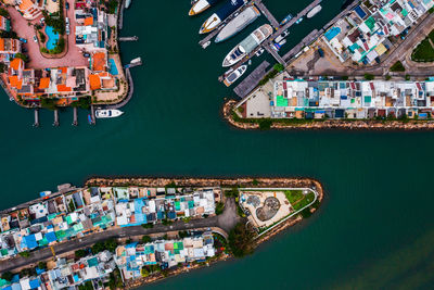 High angle view of sea and buildings in city