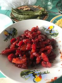 High angle view of strawberries in plate on table