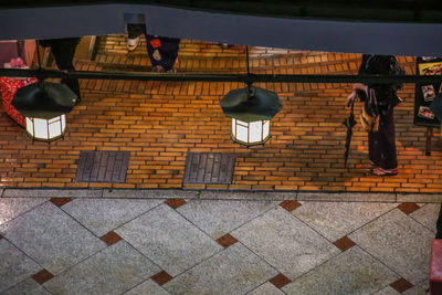 Low angle view of clothes hanging on brick wall