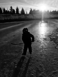 Boy on ice rink during winter