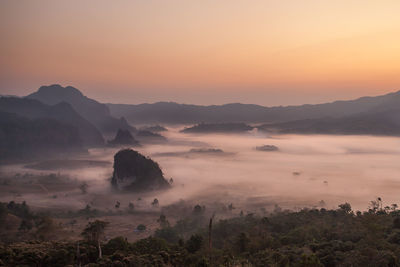 Scenic view of mountains against sky during sunset