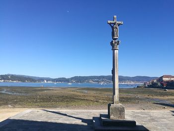 Scenic view of landscape against clear blue sky