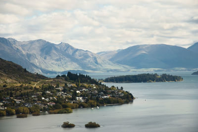 Scenic view of mountains and lake against sky