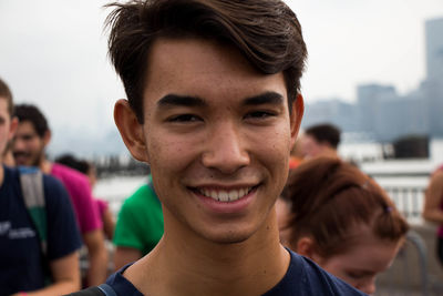 Close-up portrait of smiling young man