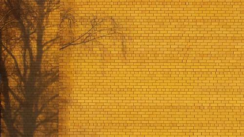 Full frame shot of yellow brick wall