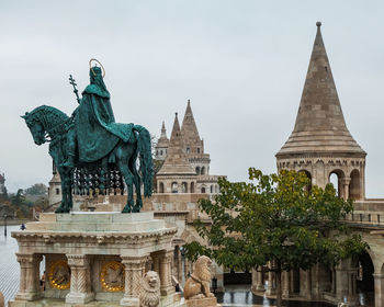Statue of historic building against sky - fisherman's bastion in budapest 