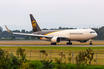 Side view of airport runway against sky