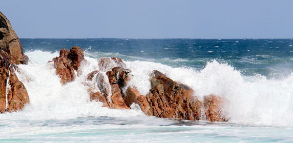 Panoramic shot of sea against clear sky