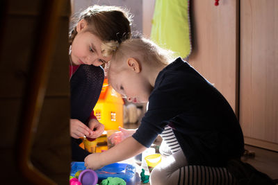 Mother and son sitting at home