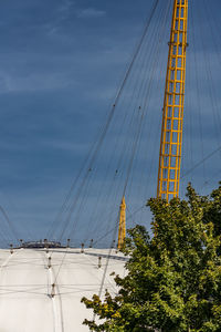 Low angle view of suspension bridge against sky