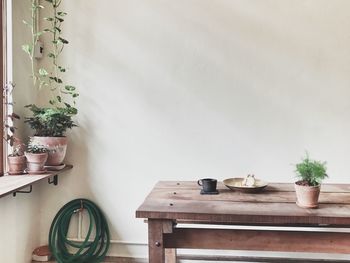 Chairs and table at home with small garden 