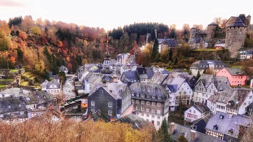 High angle view of townscape and trees in city