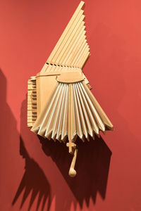 High angle view of traditional windmill against red background