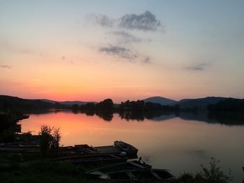 Scenic view of lake at sunset