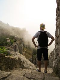 Rear view of backpacker standing on great wall of china