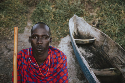 Maasai man on the beach in front of sea