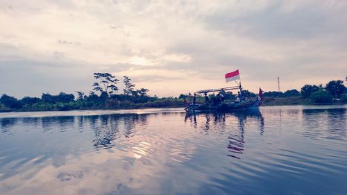 Scenic view of lake against sky during sunset