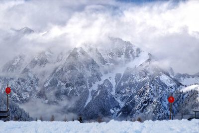 Scenic view of snow covered mountains