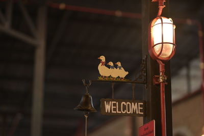 Low angle view of illuminated lamp post on street