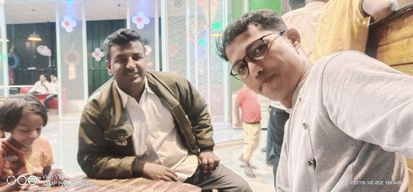 Portrait of young people sitting outdoors