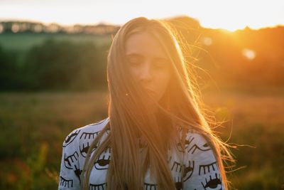 Beautiful woman with eyes closed during sunny day