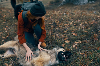 Man with dog on field