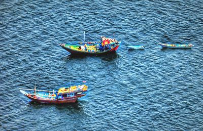 High angle view of boat sailing in sea