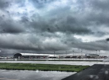 Scenic view of landscape against cloudy sky