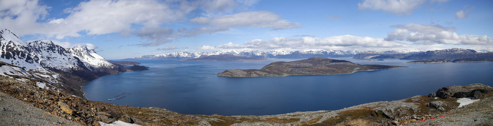 Panoramic view of sea and mountains against sky