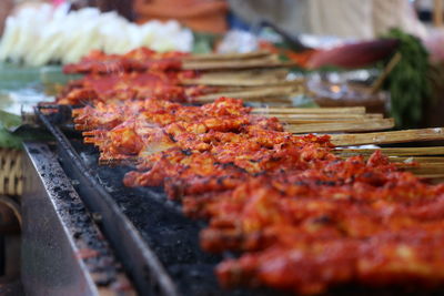 Close-up of meat on barbecue grill