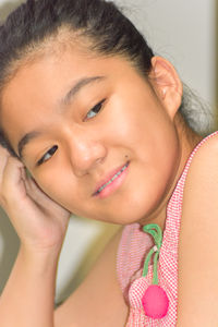 Close-up portrait of a smiling young woman