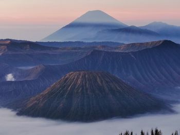 Panoramic view of volcanic mountain range against sky