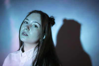 Portrait of a young woman looking away