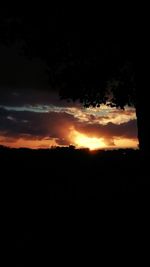 Silhouette landscape against sky during sunset