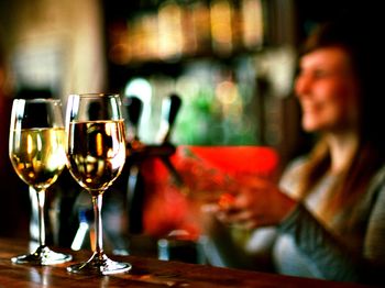 Close-up of wine glasses in restaurant