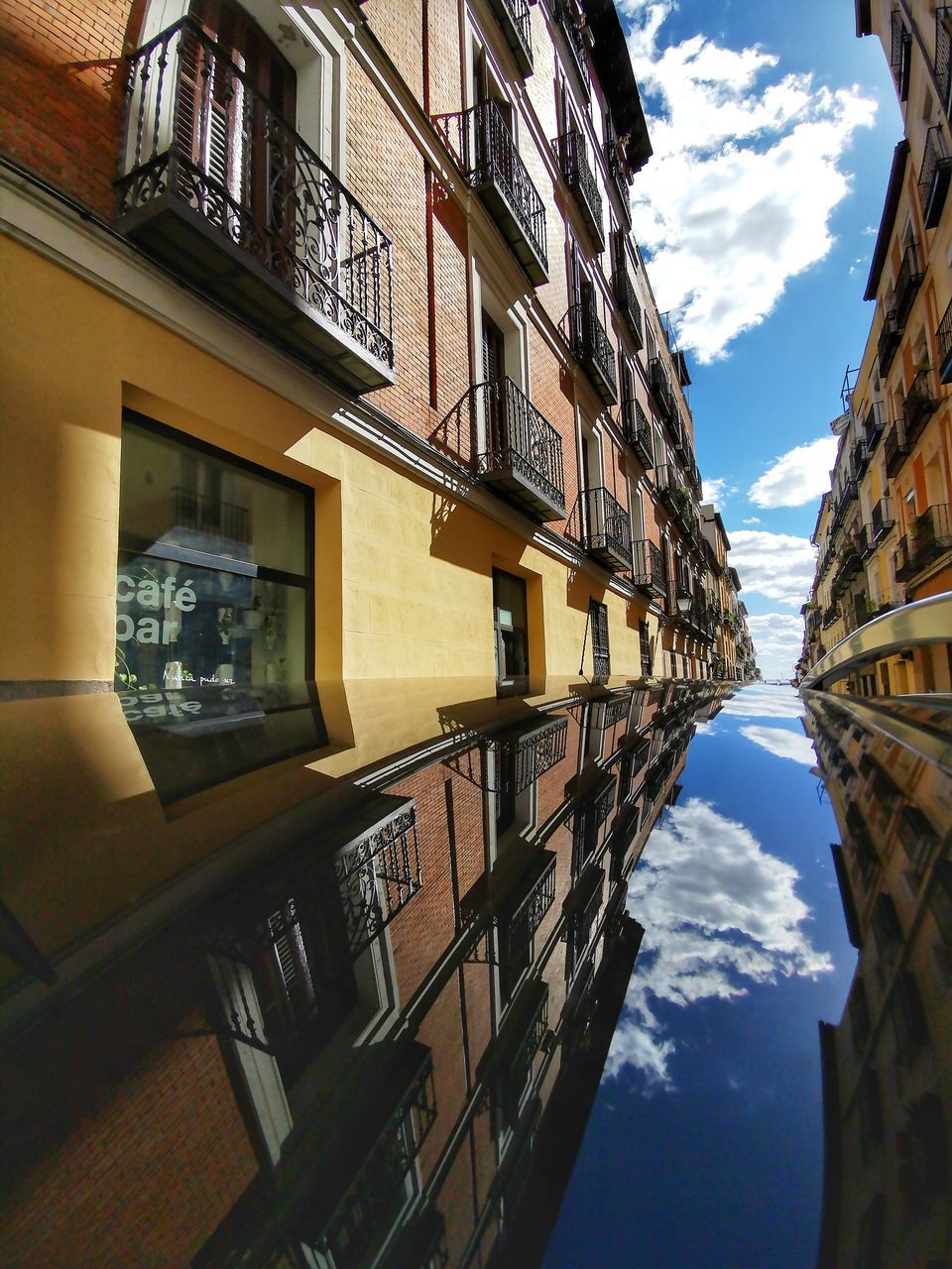 building exterior, architecture, built structure, building, sky, window, residential district, no people, day, cloud - sky, city, reflection, nature, low angle view, outdoors, water, balcony, glass - material, house, apartment, canal, directly below