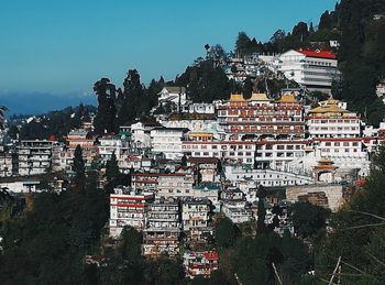 High angle view of buildings in city against sky