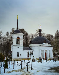 Building against sky during winter