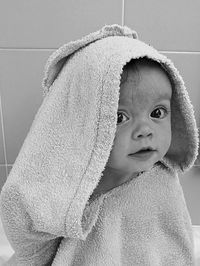 Close-up portrait of cute baby girl at home