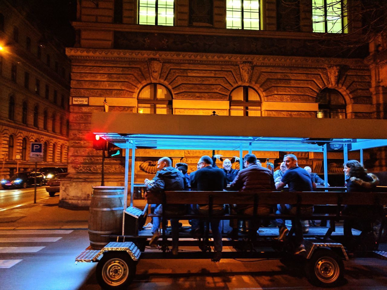 GROUP OF PEOPLE IN FRONT OF BUILDING