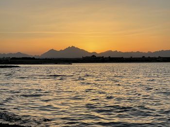 Scenic view of sea against sky during sunset