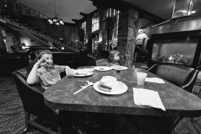 Woman eating food on table