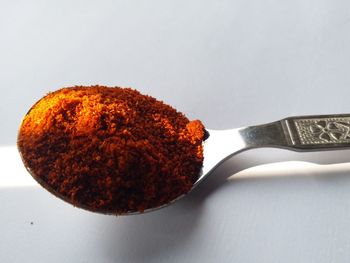 High angle view of orange on table against white background